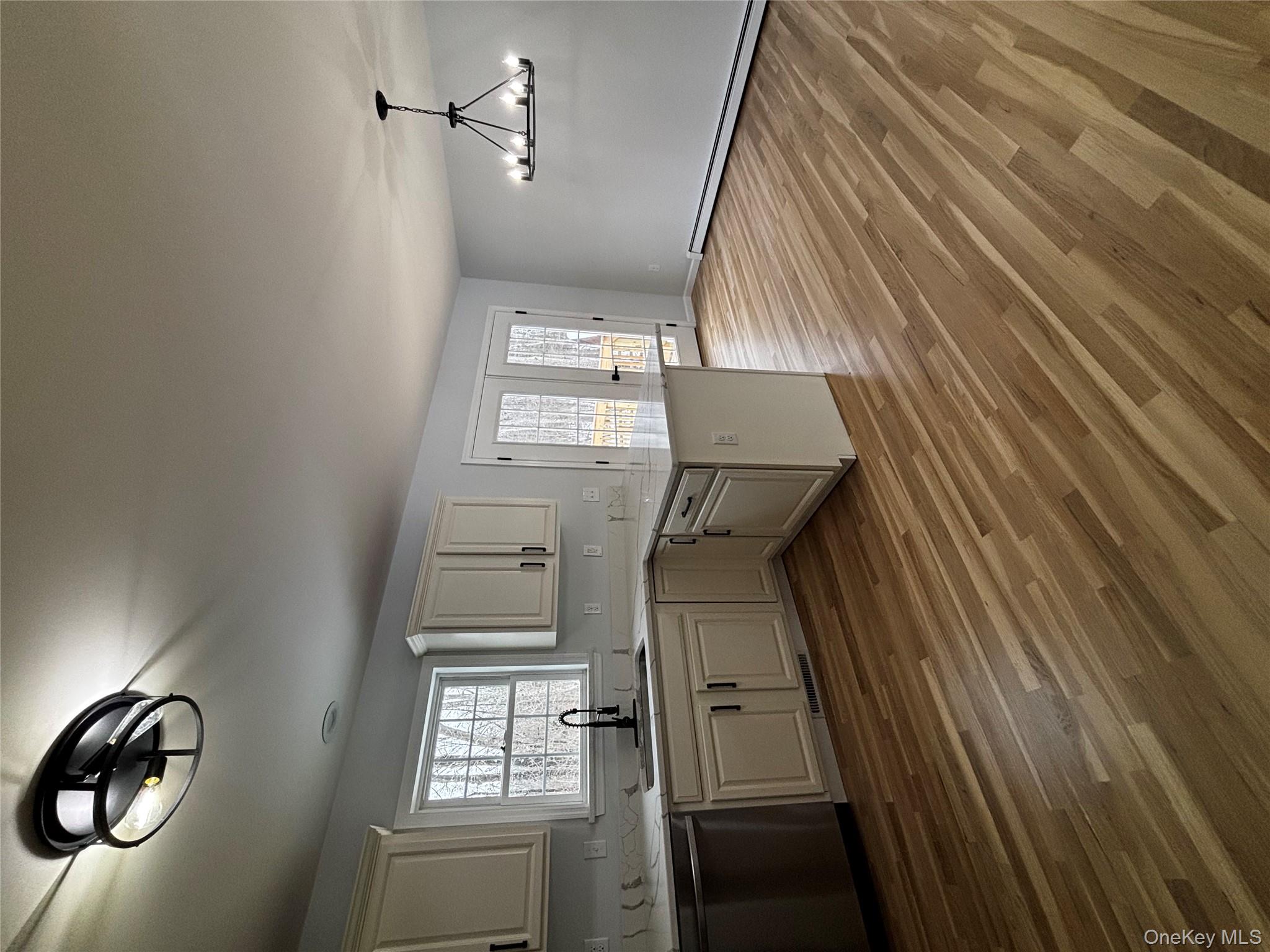 35 Pioneer Road Gardiner, NY 12525 - Photo 13 of 44 a kitchen with stainless steel appliances granite countertop a sink dishwasher and a stove with wooden floor