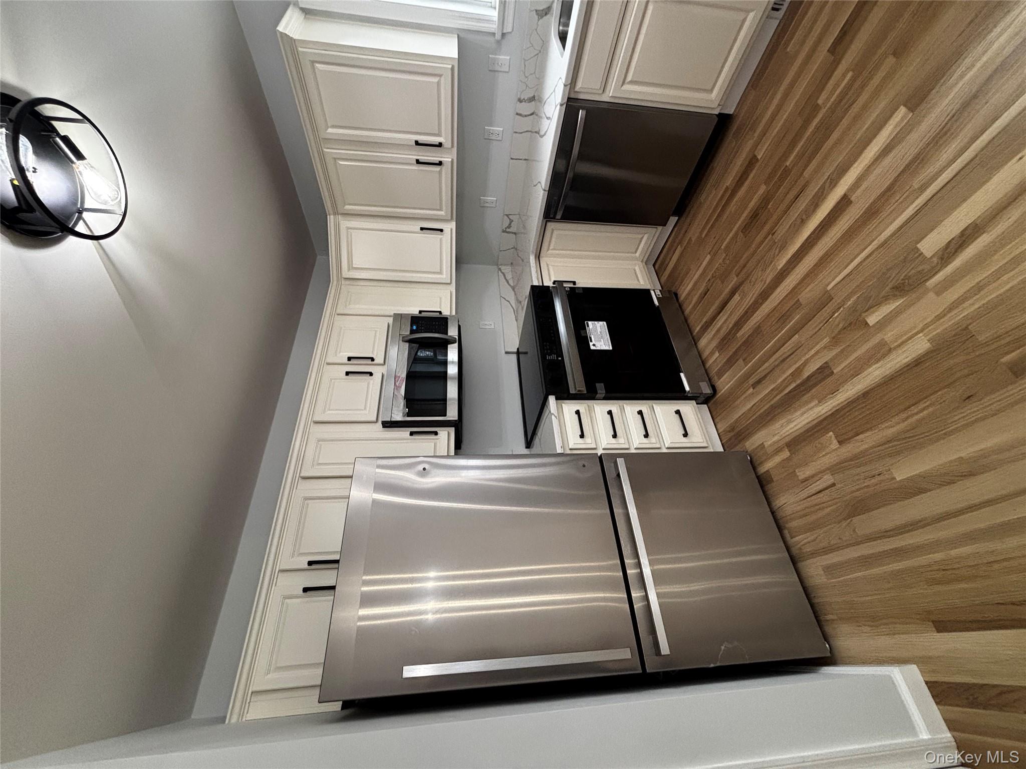 35 Pioneer Road Gardiner, NY 12525 - Photo 14 of 44 a kitchen with stainless steel appliances granite countertop a refrigerator a stove a sink and a microwave