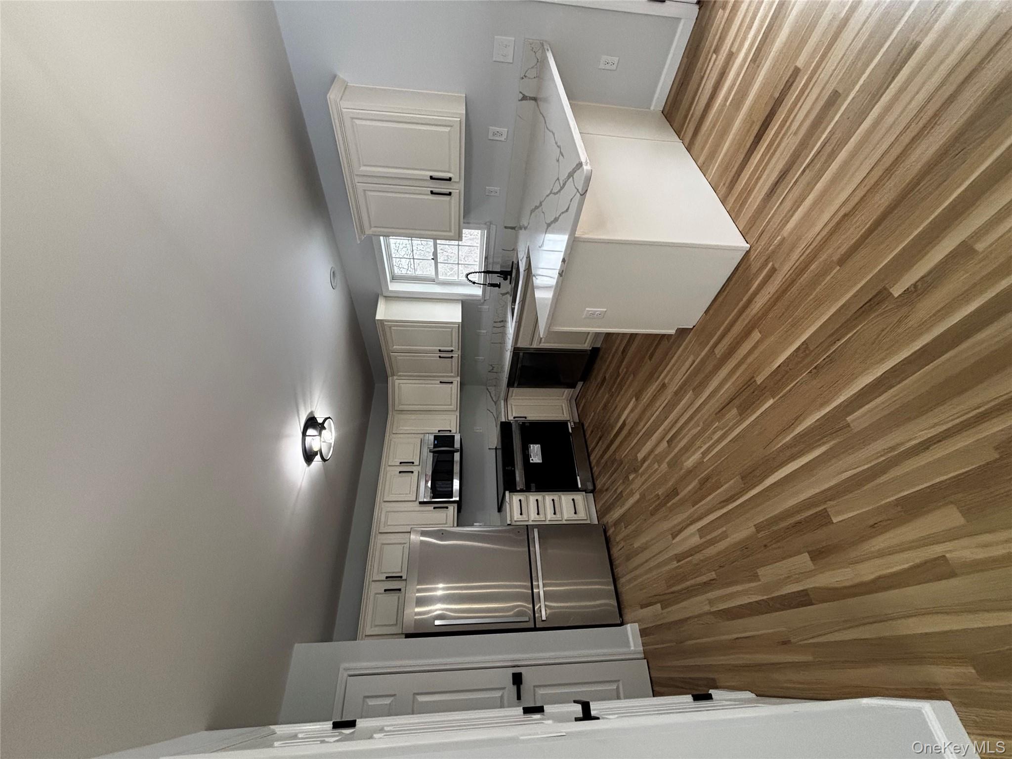 35 Pioneer Road Gardiner, NY 12525 - Photo 15 of 44 a kitchen with stainless steel appliances a refrigerator sink and cabinets