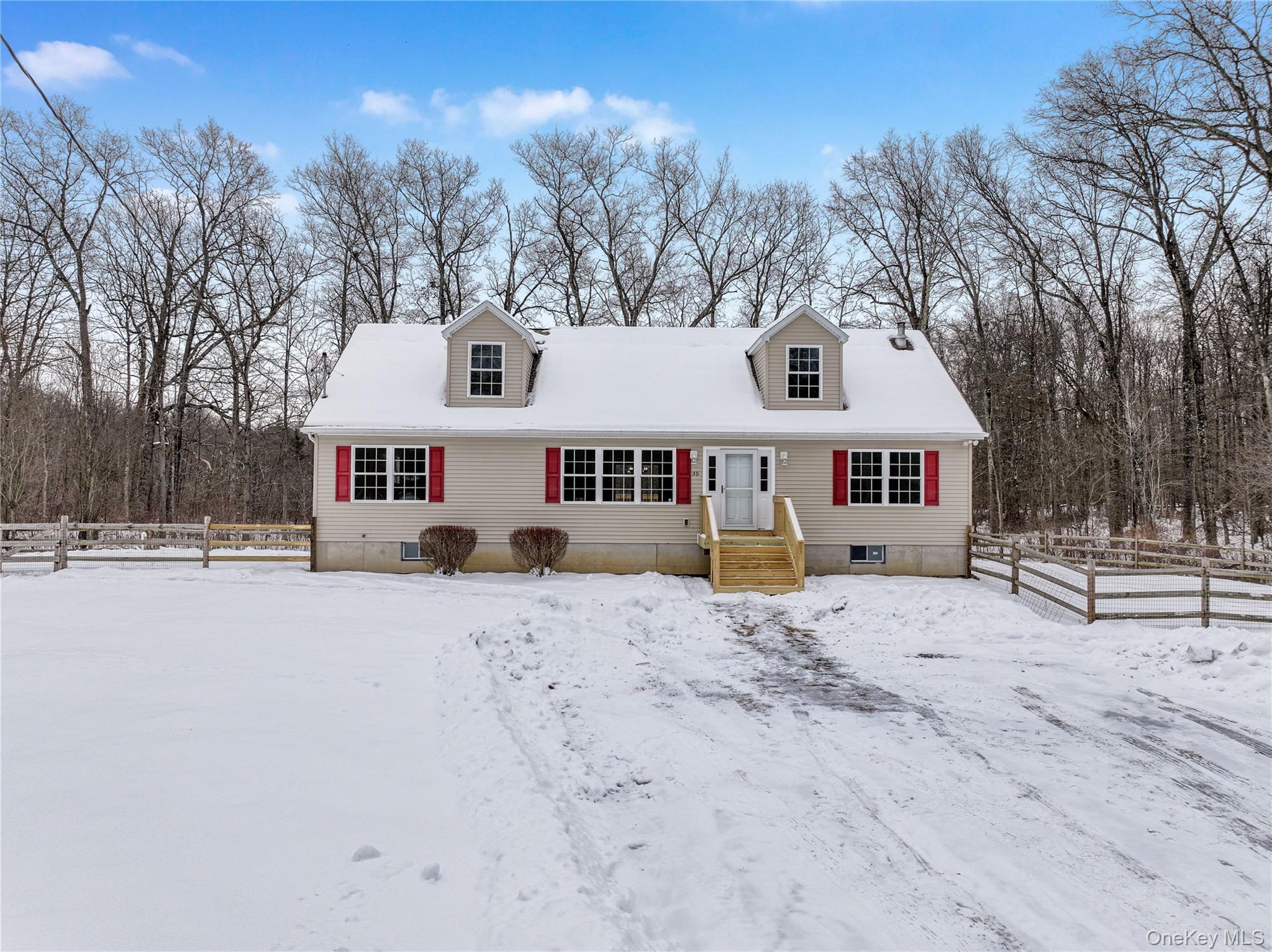 35 Pioneer Road Gardiner, NY 12525 - Photo 2 of 44 a front view of a house with a dirt yard with a large tree