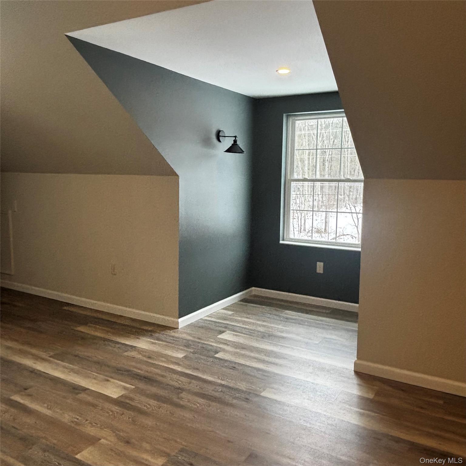 35 Pioneer Road Gardiner, NY 12525 - Photo 33 of 44 an empty room with wooden floor and windows