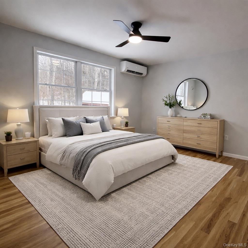 35 Pioneer Road Gardiner, NY 12525 - Photo 4 of 44 a bedroom with a large bed and a large window