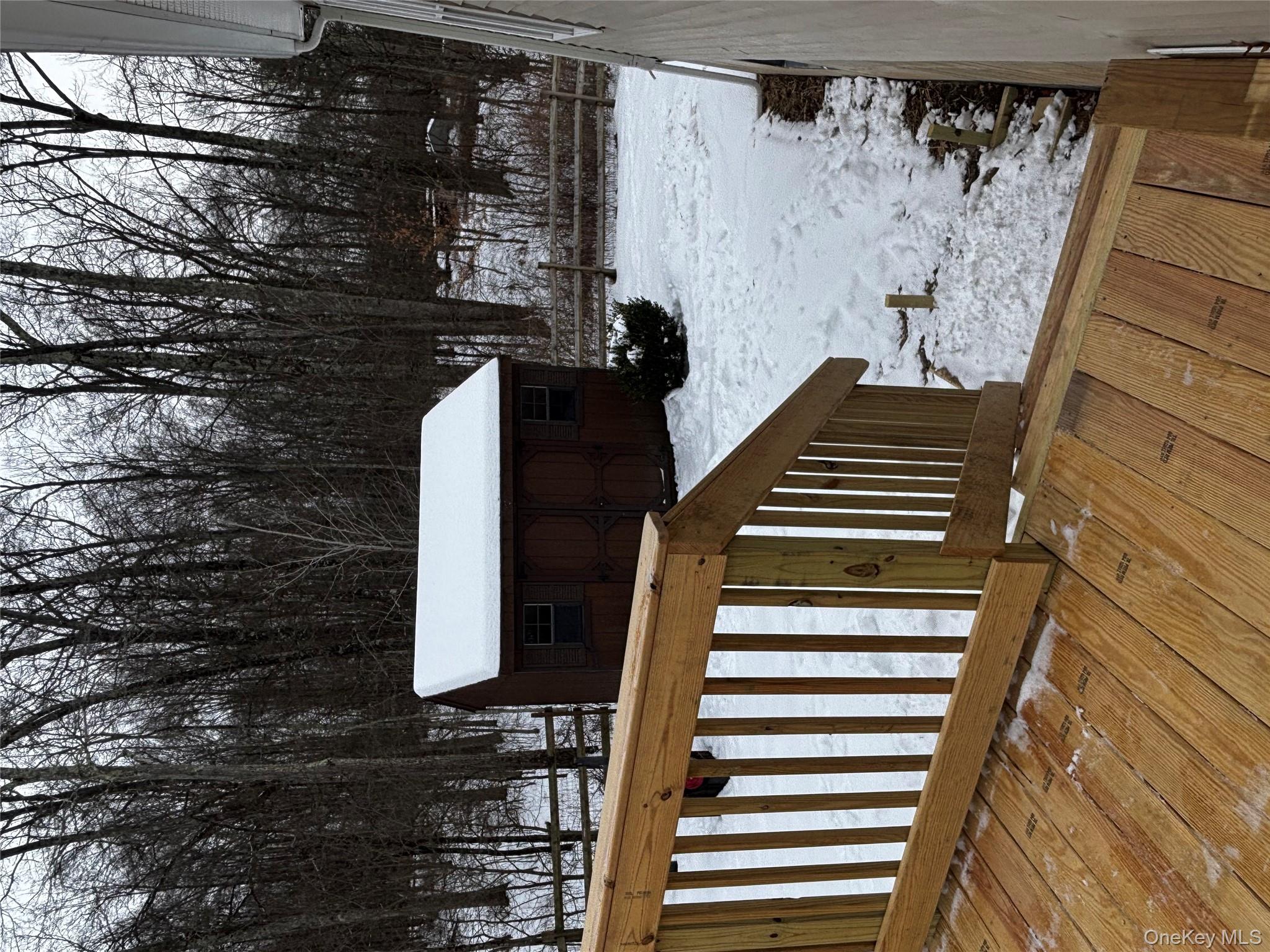 35 Pioneer Road Gardiner, NY 12525 - Photo 38 of 44 a view of wooden deck and living room with trees