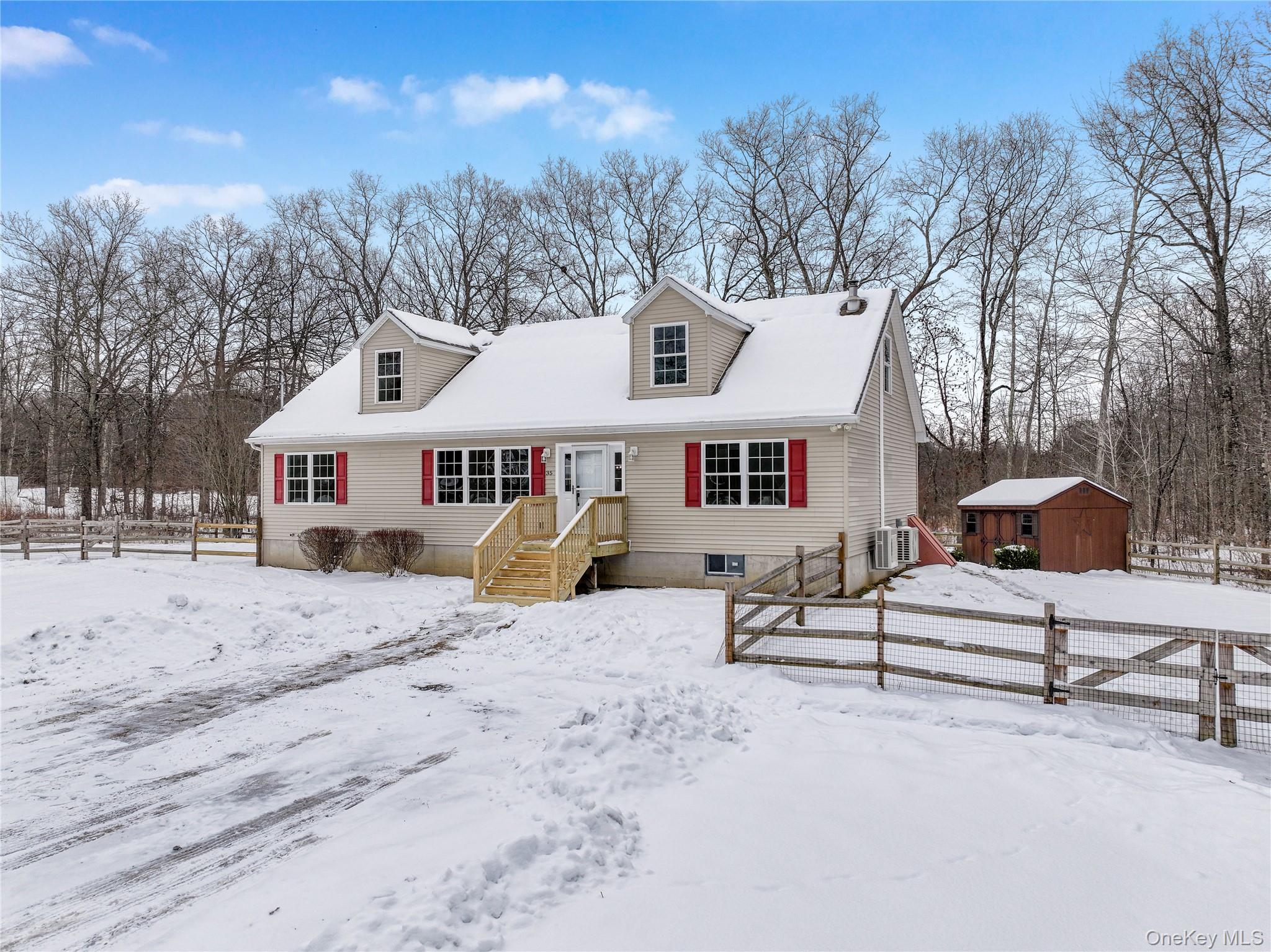 35 Pioneer Road Gardiner, NY 12525 - Photo 6 of 44 a view of a white house with a large tree in front of it