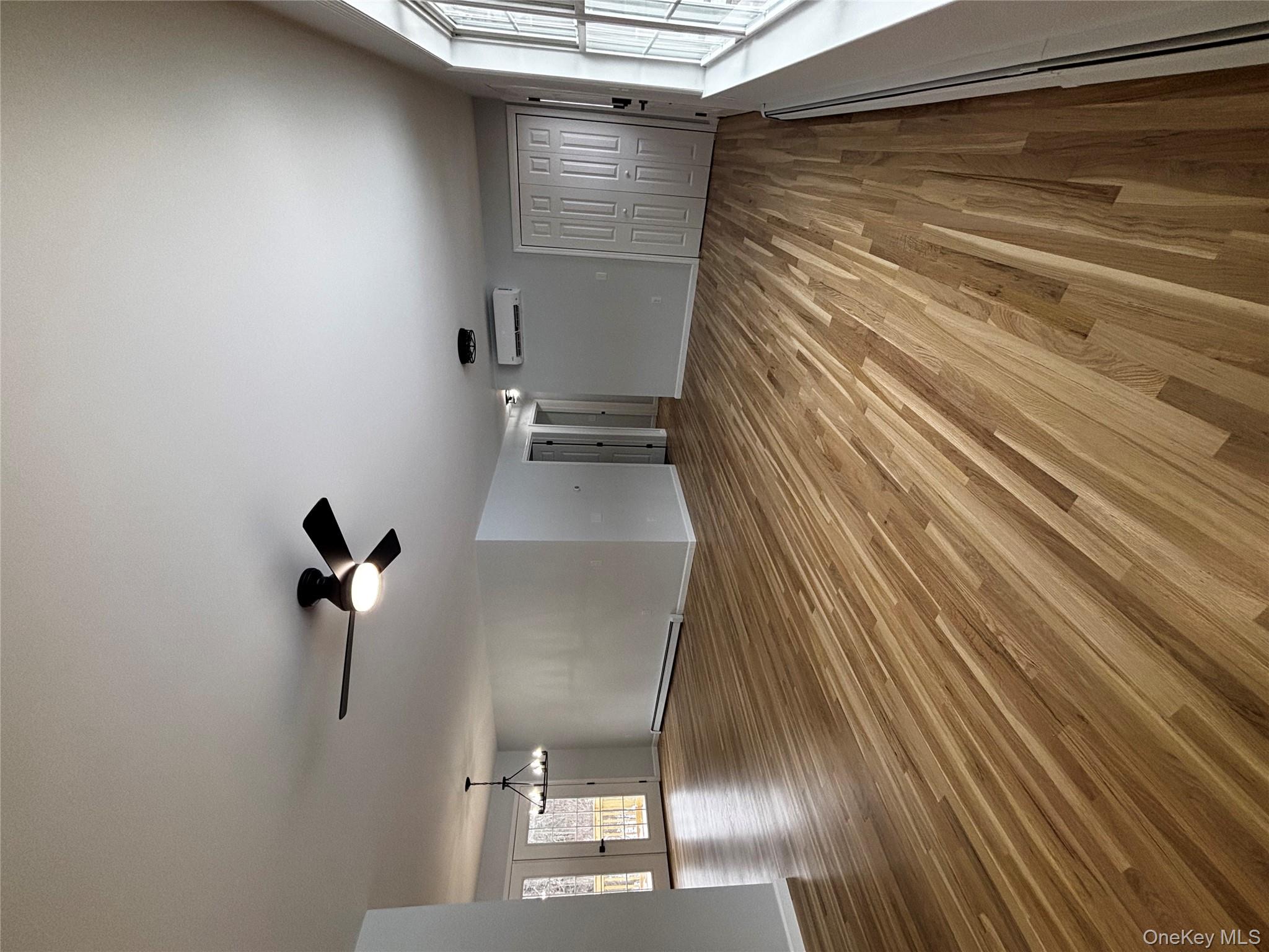 35 Pioneer Road Gardiner, NY 12525 - Photo 8 of 44 wooden floor in an empty room with a window