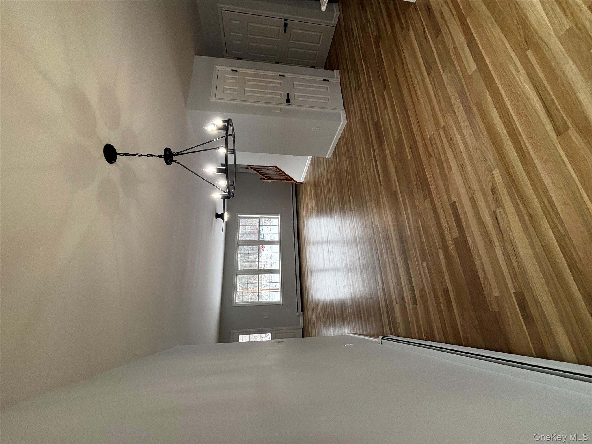 35 Pioneer Road Gardiner, NY 12525 - Photo 10 of 44 a view of a room with wooden floor chandelier and windows