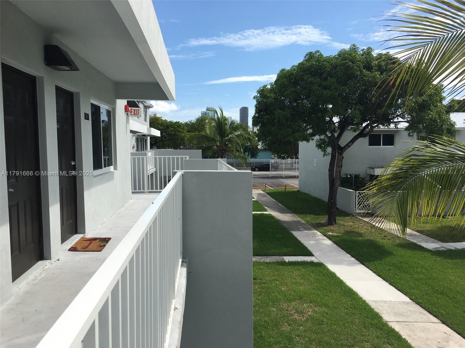 1990 Northwest 4th Court, Unit 8 Miami, FL 33136 - Photo 8 of 19 a view of balcony and yard