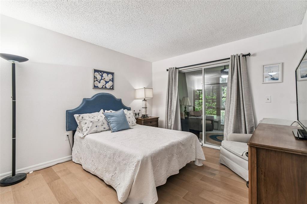 6531 Remus Drive New Port Richey, FL 34653 - Photo 12 of 39 a bedroom with a large bed and a window