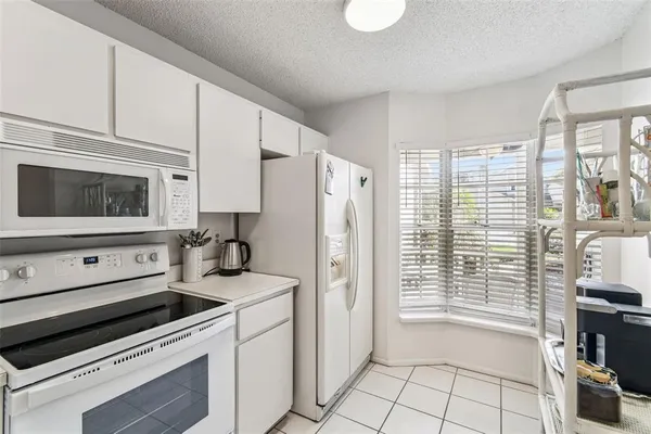 a kitchen with a stove and a microwave