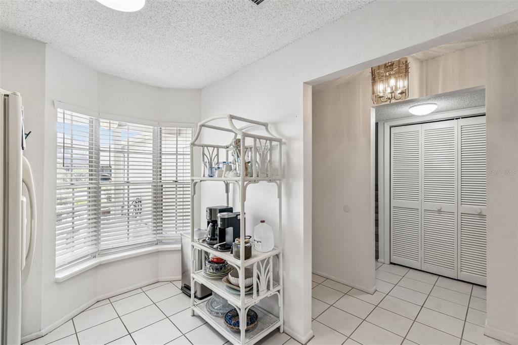6531 Remus Drive New Port Richey, FL 34653 - Photo 17 of 39 a view of empty room with wooden floor and fan