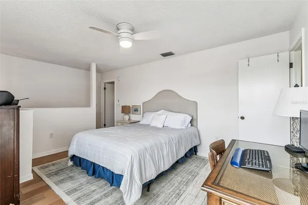 a bedroom with a bed and a couch