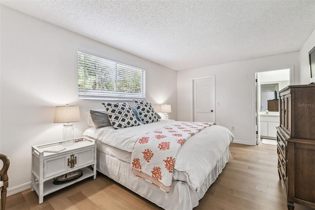 6531 Remus Drive New Port Richey, FL 34653 - Photo 21 of 39 a bedroom with a bed and a window