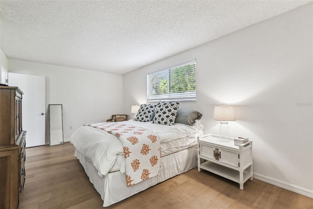 6531 Remus Drive New Port Richey, FL 34653 - Photo 22 of 39 a bedroom with a bed and a window