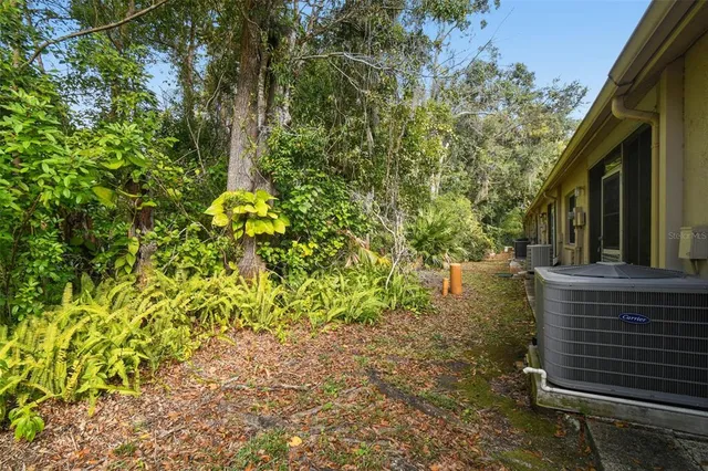 a backyard of a house with lots of green space