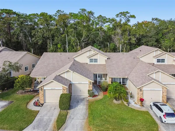 a aerial view of a house with a yard