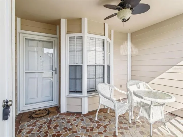 a view of a livingroom with furniture and refrigerator