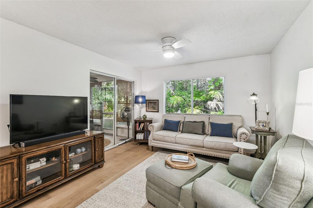 6531 Remus Drive New Port Richey, FL 34653 - Photo 4 of 39 a living room with furniture and a flat screen tv