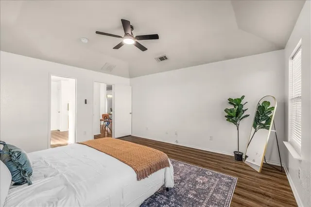 a view of a house with a swimming pool and a yard