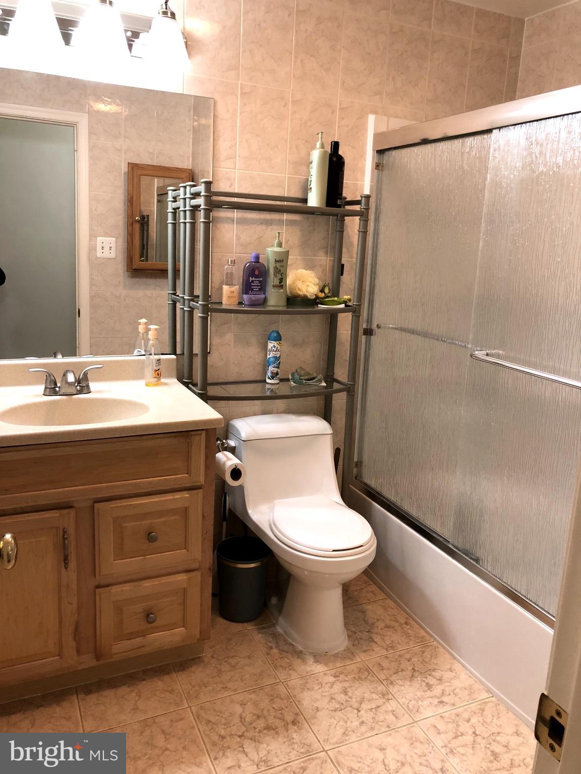 11509 Lockhart Place Silver Spring, MD 20902 - Photo 22 of 30 Bath Updated cream hallway bath.