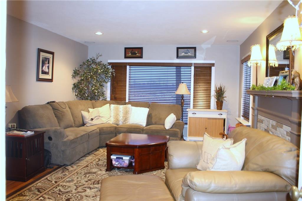125 Weckerly Road Butler, PA 16002 - Photo 3 of 23 Living Room with lots of windows and brick fireplace.