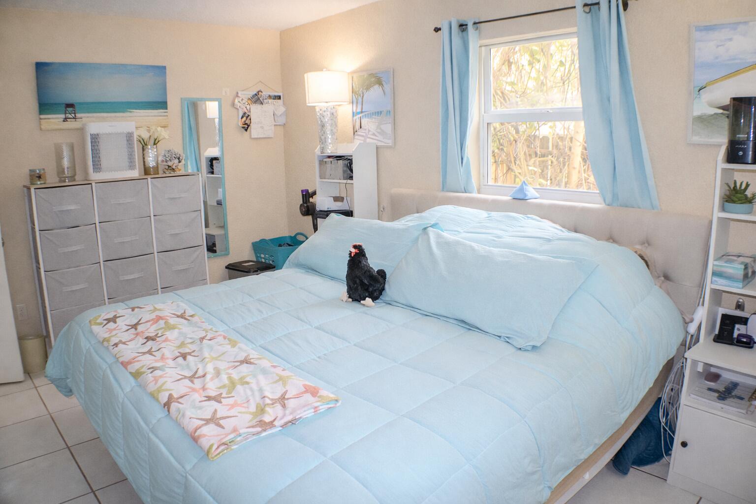 711 Sharon Place Key Largo, FL 33037 - Photo 13 of 38 a bedroom with a bed and a cabinets