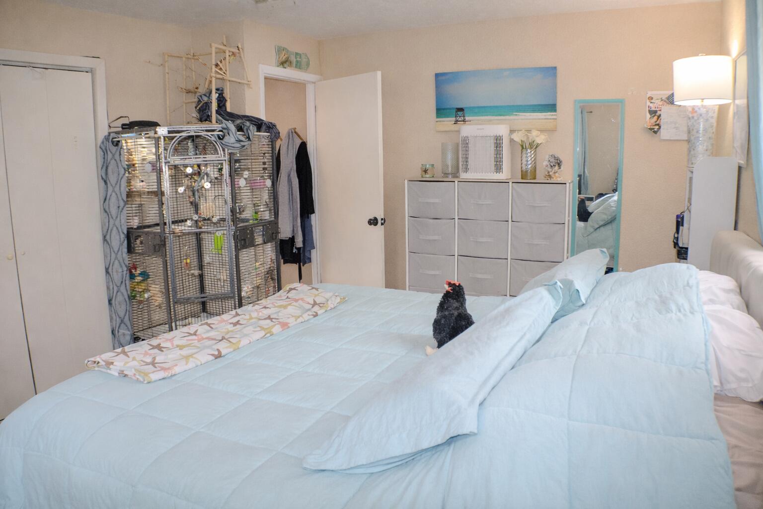 711 Sharon Place Key Largo, FL 33037 - Photo 14 of 38 a bedroom with a bed and a large mirror