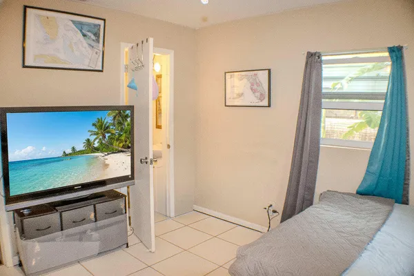 a bedroom with a bed and a desk
