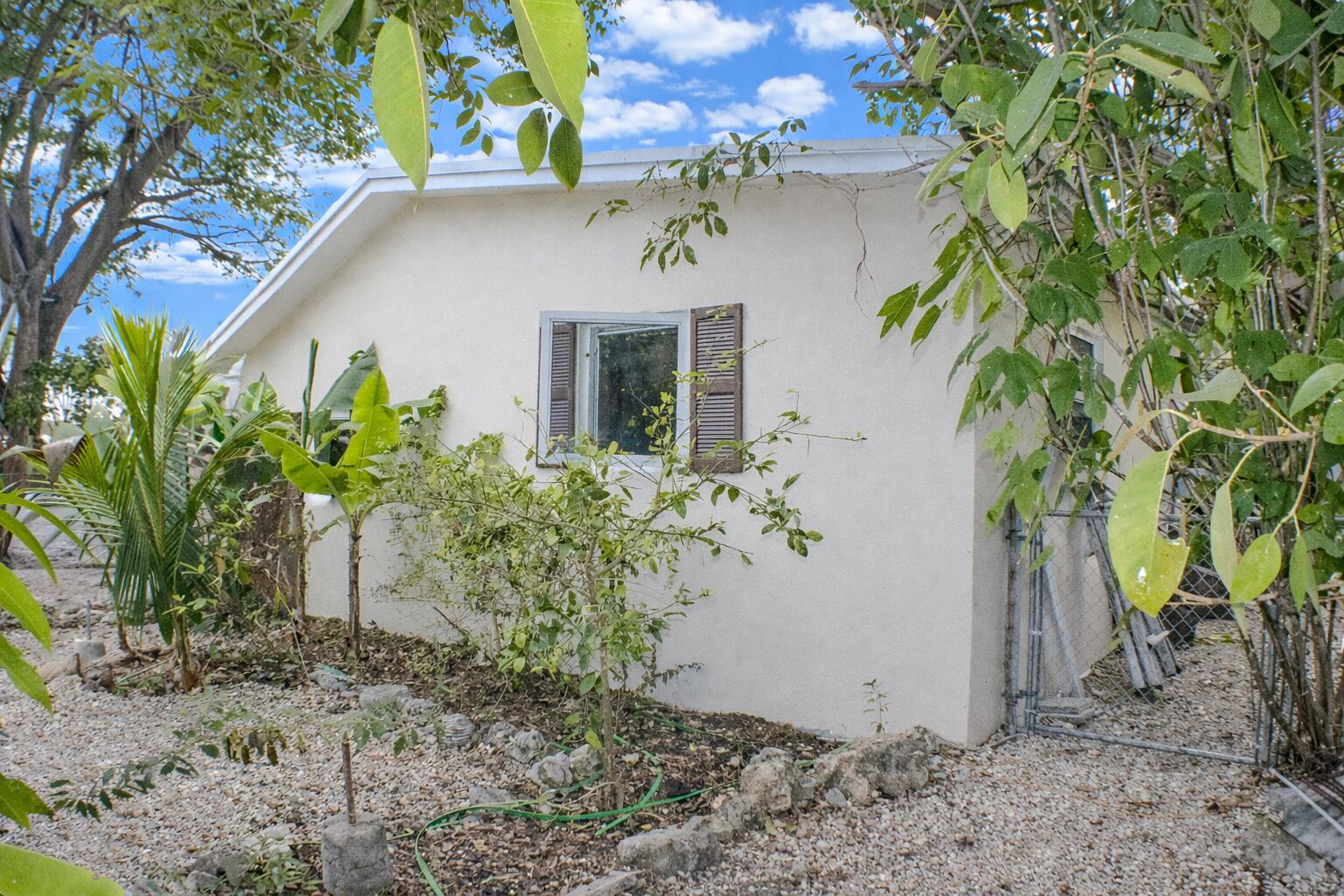 711 Sharon Place Key Largo, FL 33037 - Photo 2 of 38 a view of a house with a yard