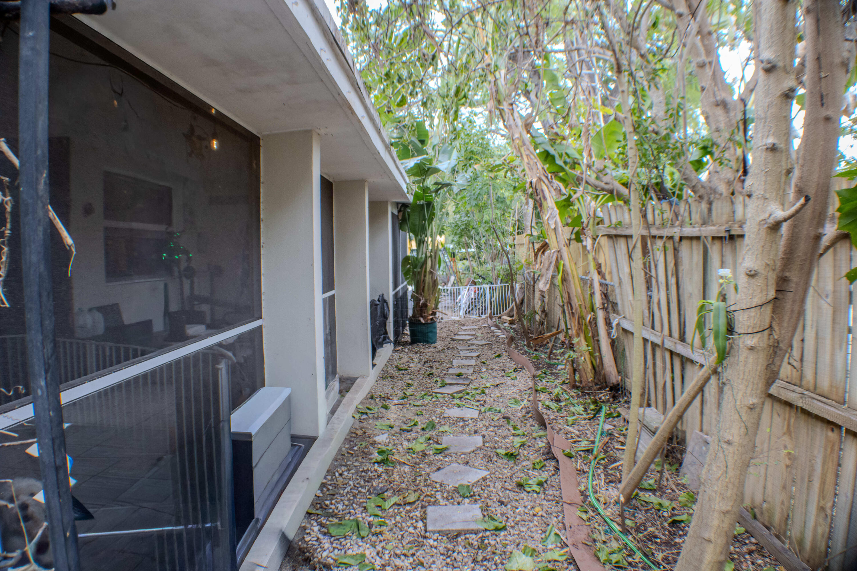 711 Sharon Place Key Largo, FL 33037 - Photo 27 of 38 a view of a pathway of a house with wooden floor