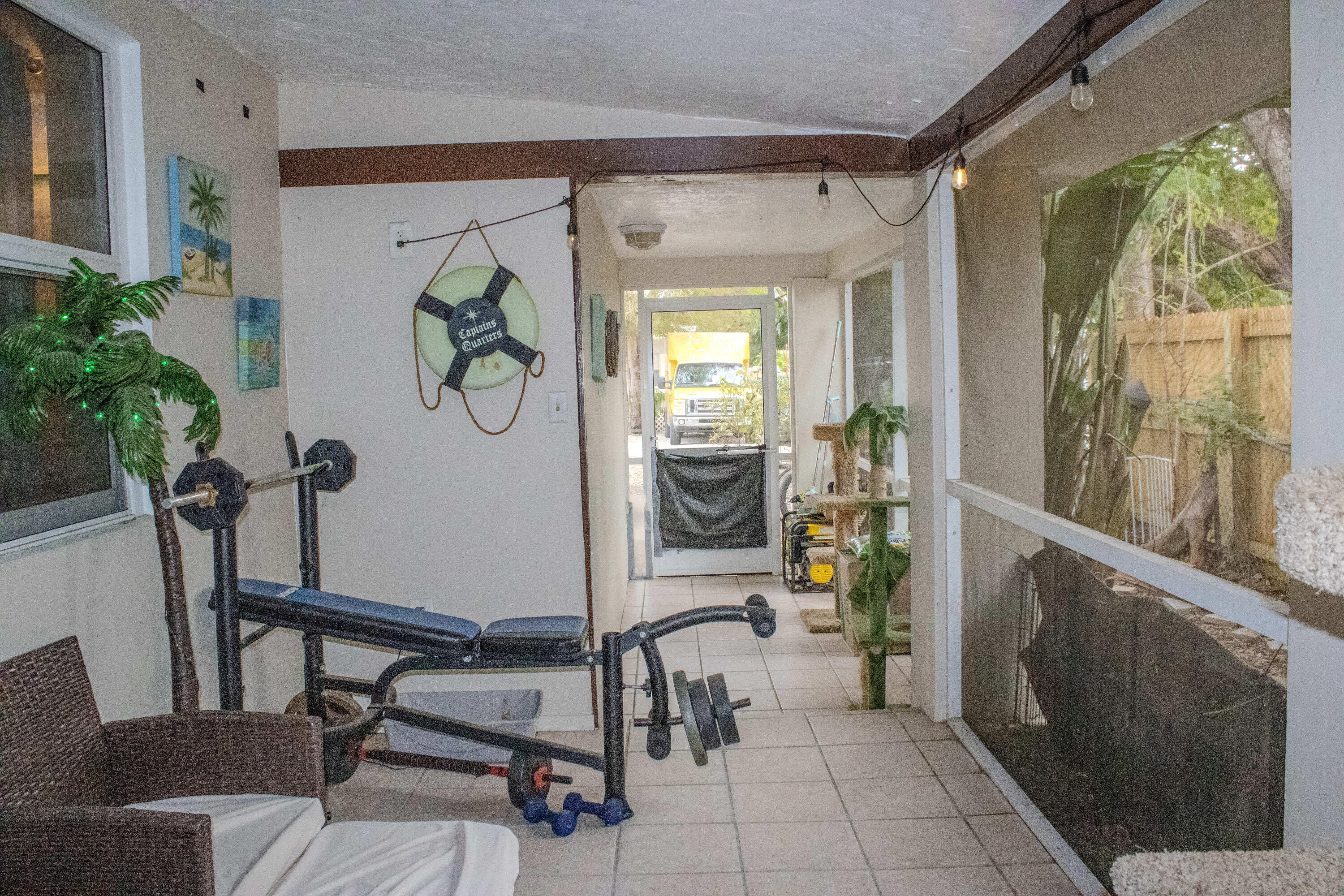 711 Sharon Place Key Largo, FL 33037 - Photo 35 of 38 a view of a hallway with dining area windows and entryway