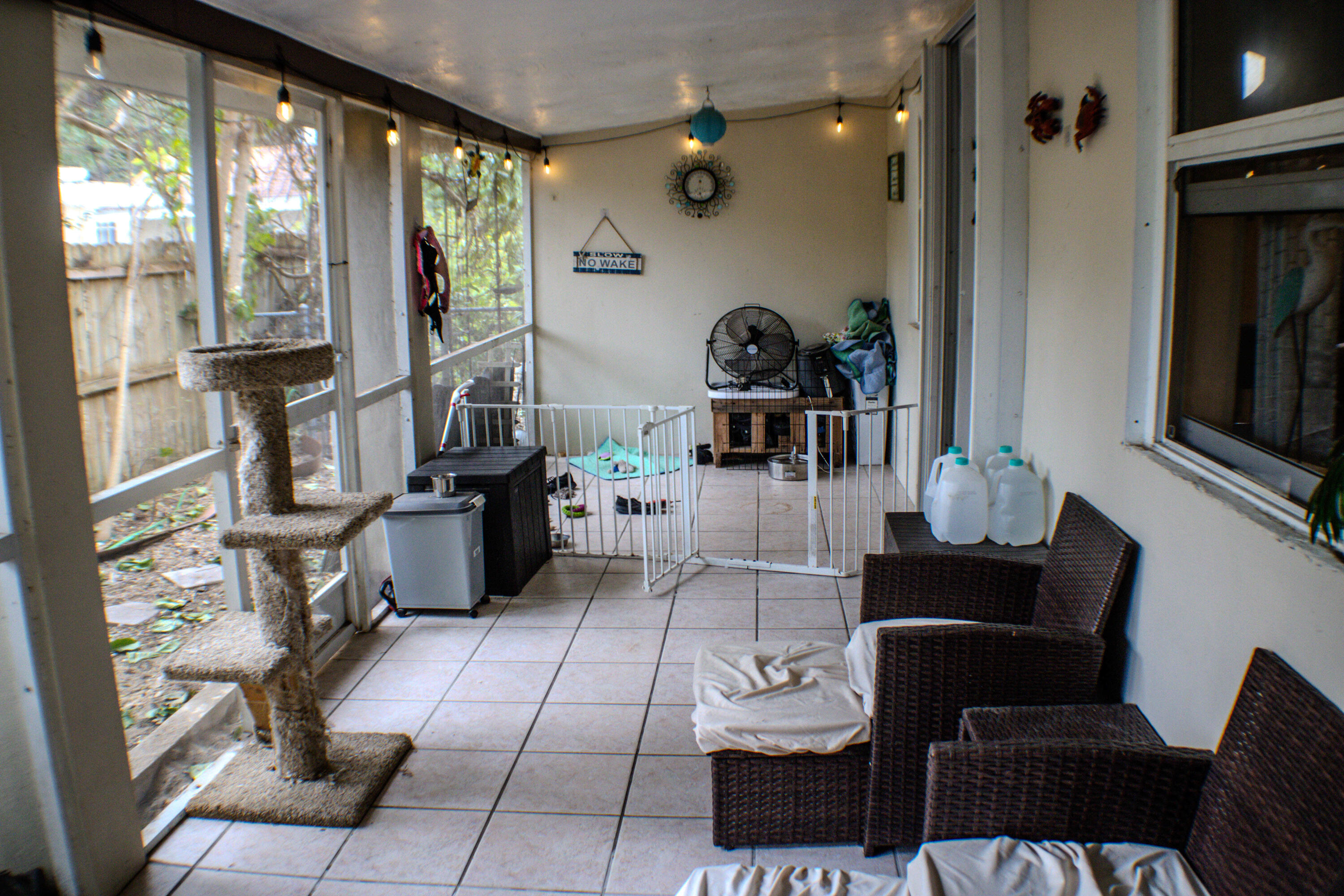 711 Sharon Place Key Largo, FL 33037 - Photo 37 of 38 a living room with furniture a flat screen tv and a floor to ceiling window