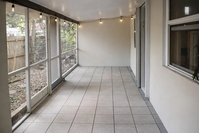 a view of empty room with windows