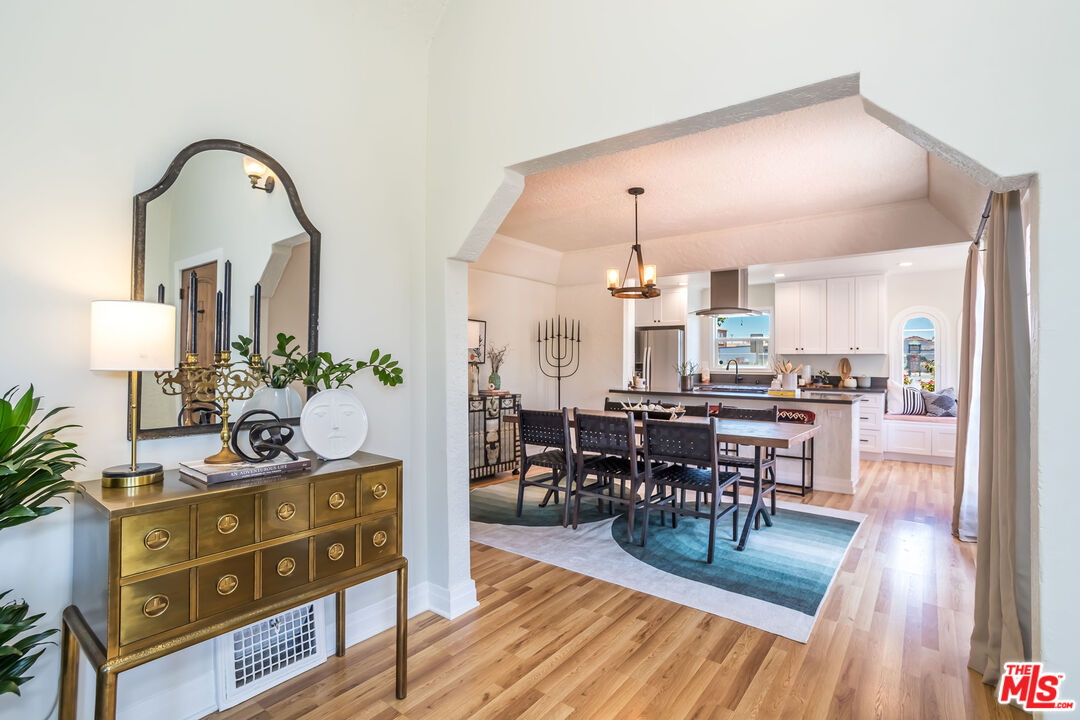 2850 Buckingham Road Los Angeles, CA 90016 - Photo 11 of 34 a view of a dining room with furniture and wooden floor