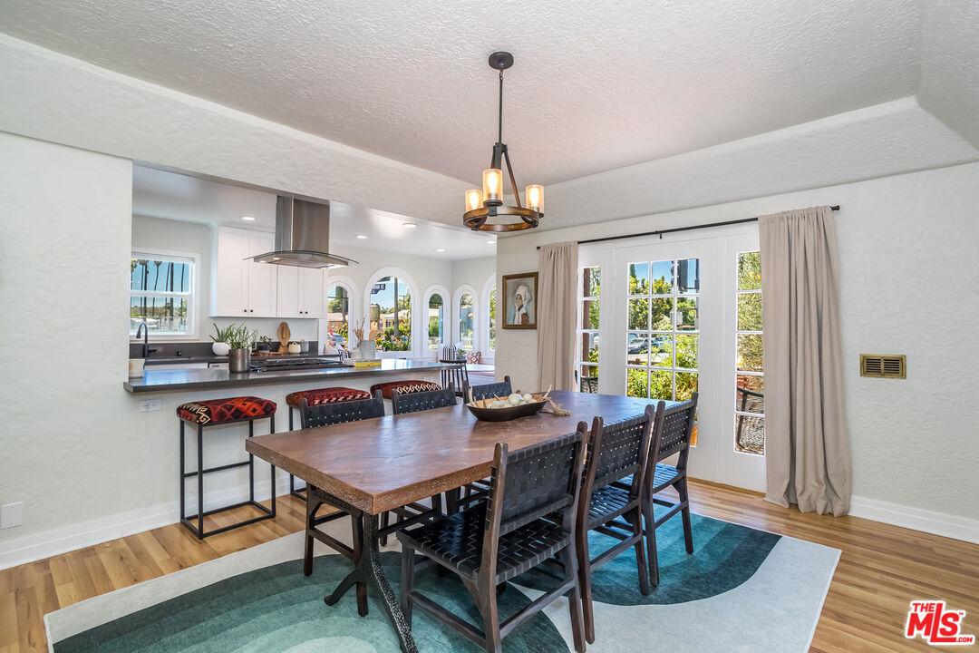 2850 Buckingham Road Los Angeles, CA 90016 - Photo 12 of 34 a view of a dining room with furniture window and wooden floor