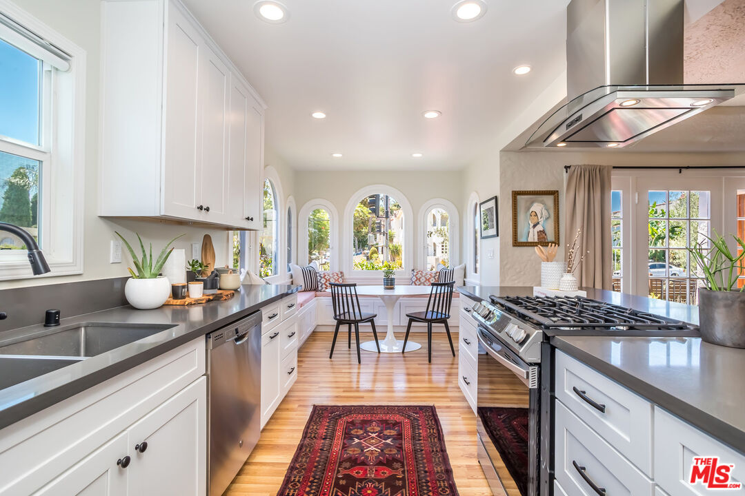 2850 Buckingham Road Los Angeles, CA 90016 - Photo 13 of 34 a kitchen with a sink and cabinets