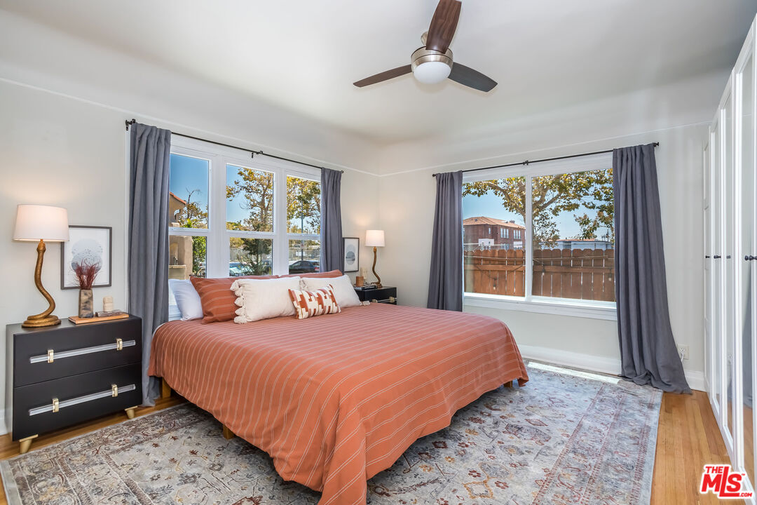 2850 Buckingham Road Los Angeles, CA 90016 - Photo 19 of 34 a bedroom with a large bed and a window
