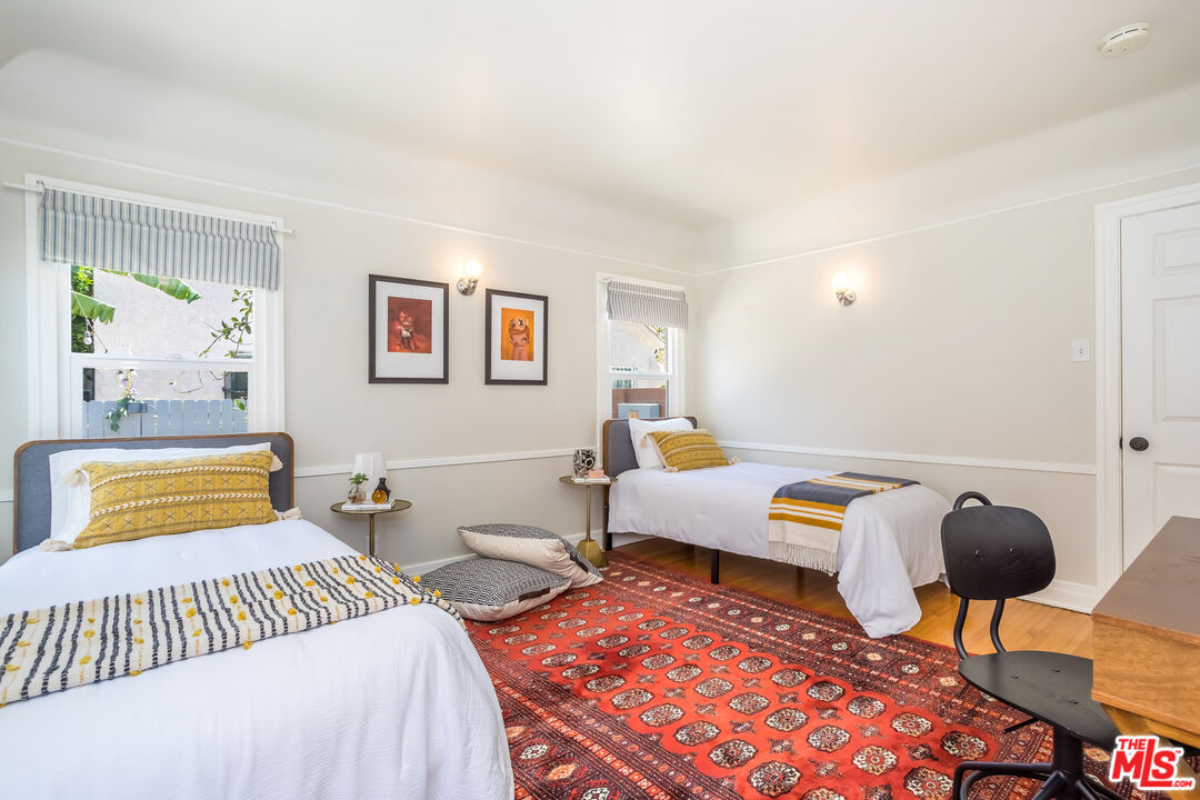 2850 Buckingham Road Los Angeles, CA 90016 - Photo 24 of 34 a bedroom with furniture and a rug