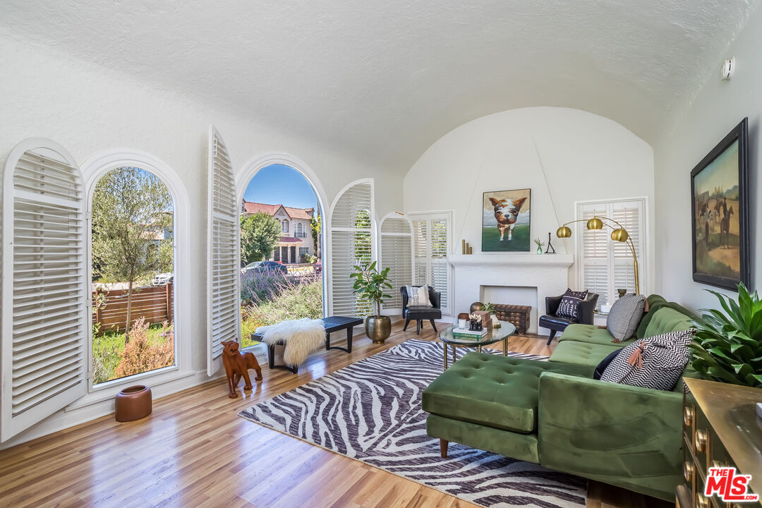 2850 Buckingham Road Los Angeles, CA 90016 - Photo 8 of 34 a living room with furniture and a large window