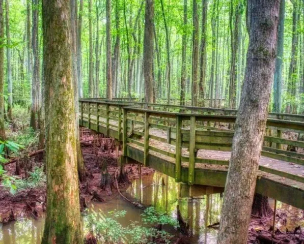 a view of a swimming pool with an outdoor space and seating area