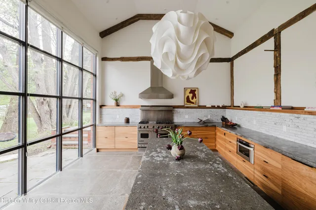 a view of staircase with wooden floor and a window