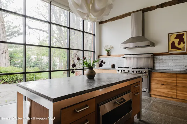 a bathroom with a sink toilet and a mirror