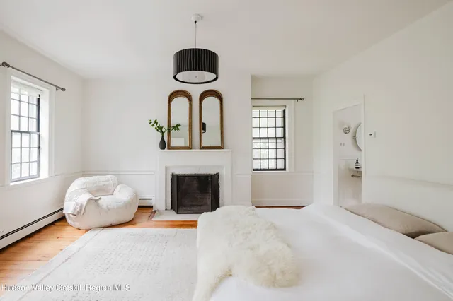 a bathroom with a sink a mirror and shower