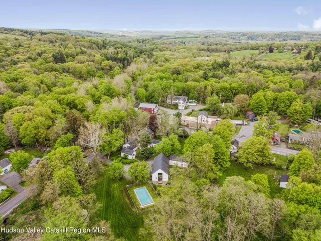 a view of a swimming pool with a yard