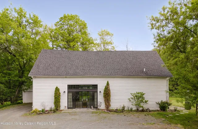 a bedroom with two beds and a window