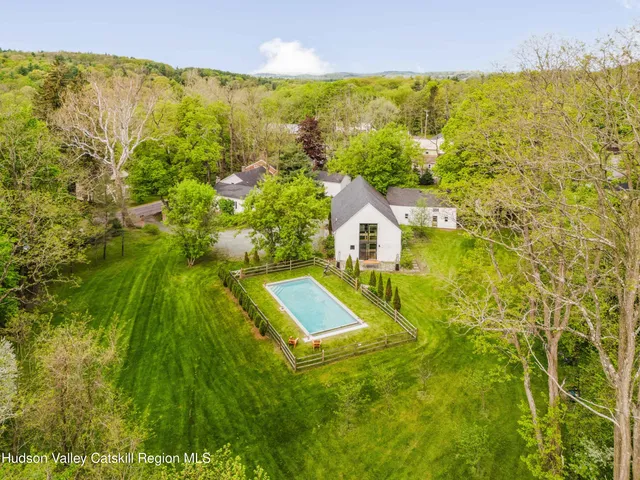 a bathroom with a granite countertop toilet sink and shower