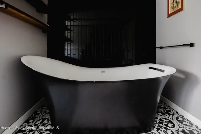 a bathroom with a shower and a window