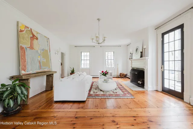 a kitchen with a stove a sink and a window