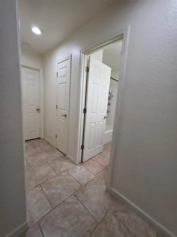 a view of a bathroom with a sink and a mirror