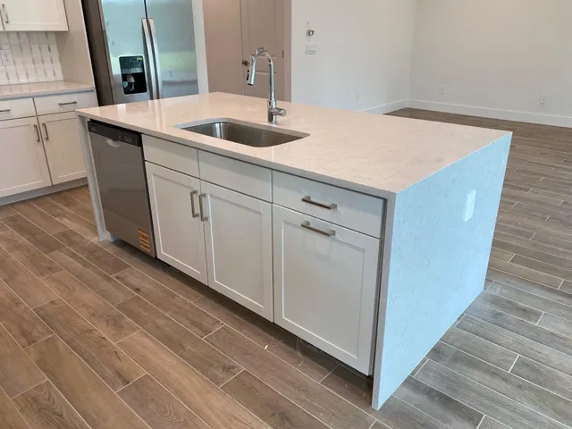 a kitchen with a sink and cabinets