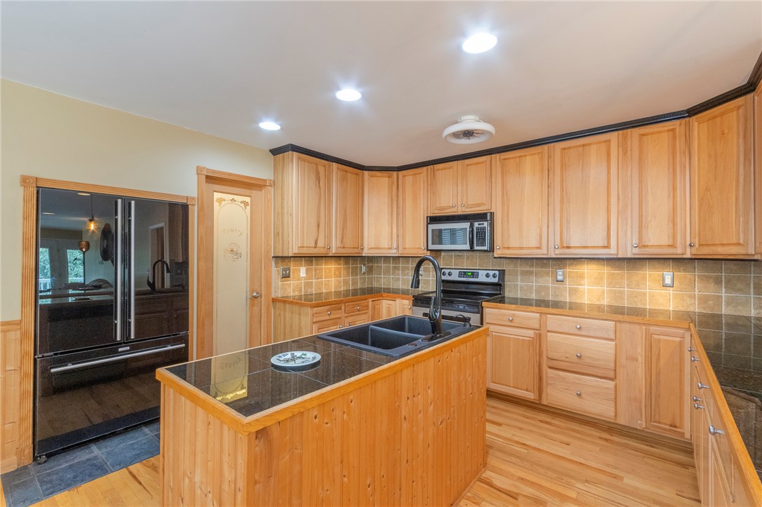 125 Inlet Pointe Drive Anderson, SC 29625 - Photo 13 of 39 A well-equipped kitchen features a central island, light wood cabinetry, and recessed lighting.